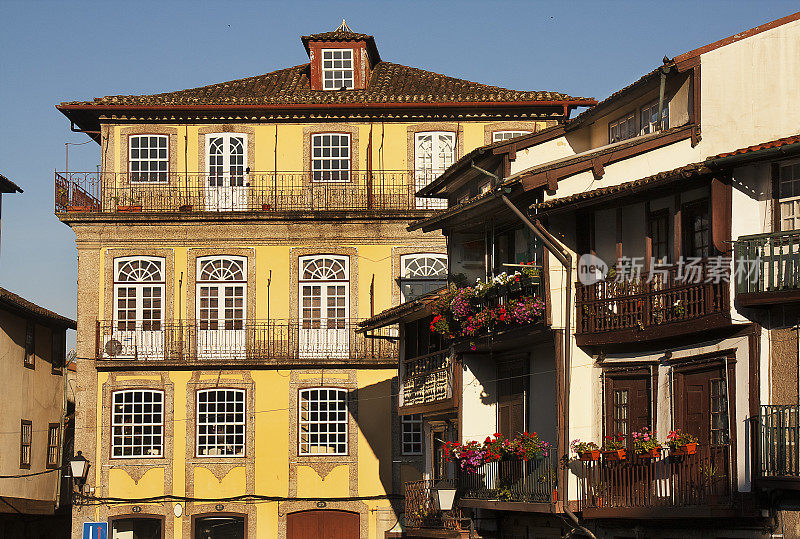 Traditional houses in S Tiago medieval town square. Guimarães, Portugal.